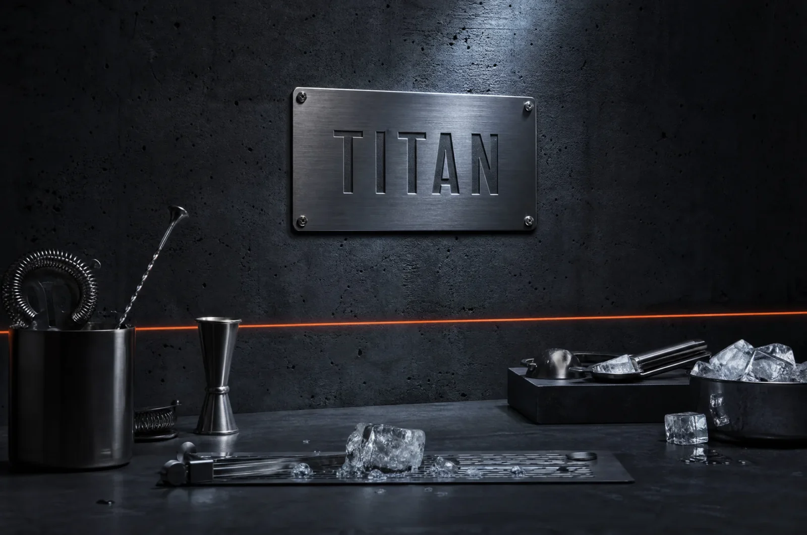 A brushed steel plate engraved TITAN on a concrete wall above a bar counter